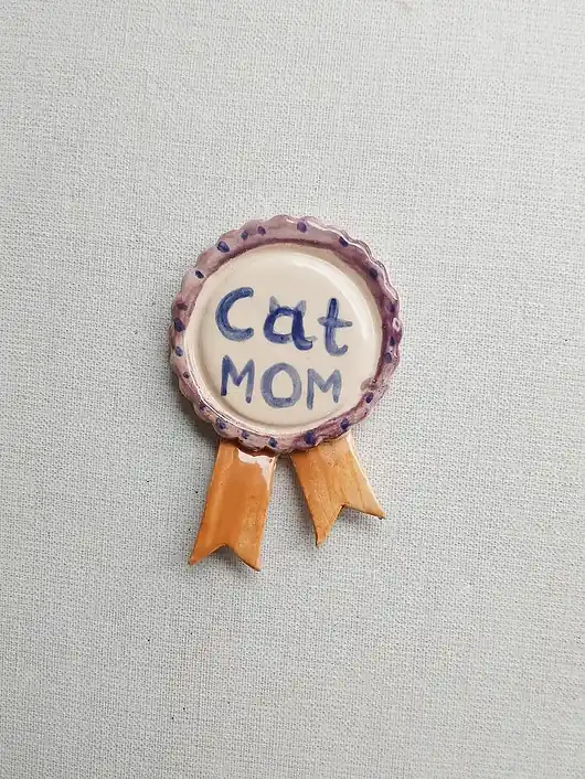 Magnes order medal CAT MOM Hit cenowy