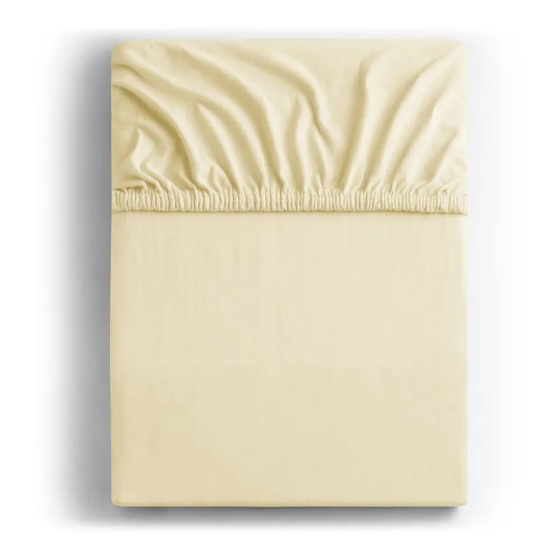 Bezpieczne zakupy Kremowe dżersejowe prześcieradło z gumką 180x200 cm Amber – Restilo Bonami